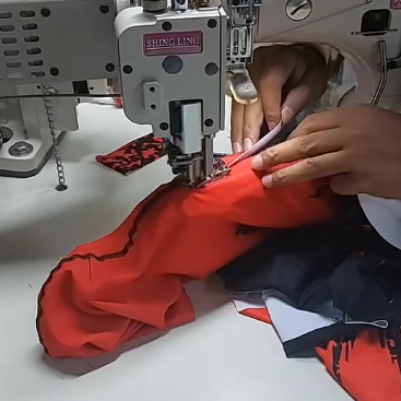 Leggings being flatlock stitched on the production line at GYMHUR manufacturing facility, Sialkot Pakistan