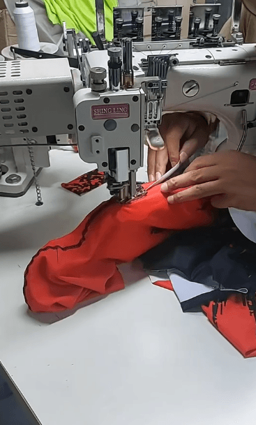 Leggings being flatlock stitched on the production line at GYMHUR manufacturing facility, Sialkot Pakistan